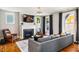 Cozy living room with fireplace, large windows, and hardwood floors at 1168 Great Ridge Pkwy, Chapel Hill, NC 27516
