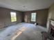 Bedroom featuring windows and a fireplace awaiting to be restored at 12670 School House Rd, Middlesex, NC 27557