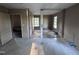 Open living room with windows and views of outside to be restored at 12670 School House Rd, Middlesex, NC 27557