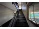 View of the staircase, with dark wood and light walls, leading to the upper level at 12670 School House Rd, Middlesex, NC 27557