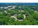 Aerial shot of a lush, green community with apartment buildings nestled among tall trees at 1320 Park Glen Drive Dr # 204, Raleigh, NC 27610
