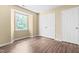 Bedroom with hardwood floors, a window, and a closet providing storage at 1320 Park Glen Drive Dr # 204, Raleigh, NC 27610