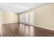Bright living room featuring hardwood floors and access to the outdoors through a large glass door at 1320 Park Glen Drive Dr # 204, Raleigh, NC 27610