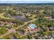 Aerial view of the community with a pool, lake, golf course and beautiful lush landscaping at 1326 Fairview Club Dr, Wake Forest, NC 27587