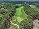 Beautiful aerial view of a lush green golf course surrounded by mature trees at 1326 Fairview Club Dr, Wake Forest, NC 27587