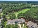 Stunning aerial view of townhomes backing up to a lush green golf course at 1326 Fairview Club Dr, Wake Forest, NC 27587