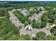 Sprawling aerial view of a residential neighborhood with lush trees and well-manicured lawns at 1326 Fairview Club Dr, Wake Forest, NC 27587