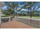 Inviting back deck showcasing scenic golf course views with American flag waving in the breeze at 1326 Fairview Club Dr, Wake Forest, NC 27587