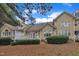 View of backyard and rear of house featuring multi-level decks and landscaping at 1326 Fairview Club Dr, Wake Forest, NC 27587