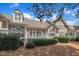 View of the rear of the house from the backyard, which features a deck and landscaping at 1326 Fairview Club Dr, Wake Forest, NC 27587