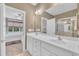 Bright bathroom with double sink vanity, large mirror, and open access to bedroom at 1326 Fairview Club Dr, Wake Forest, NC 27587