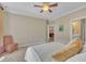 This cozy bedroom features a ceiling fan and easy access to other rooms at 1326 Fairview Club Dr, Wake Forest, NC 27587