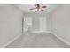 Neutral bedroom featuring carpet and a ceiling fan and two doors at 1326 Fairview Club Dr, Wake Forest, NC 27587