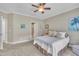 Comfortable bedroom with soft carpet, soothing neutral colors, and bright natural light at 1326 Fairview Club Dr, Wake Forest, NC 27587