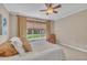 Comfortable bedroom with soft carpet, soothing neutral colors, and bright natural light at 1326 Fairview Club Dr, Wake Forest, NC 27587
