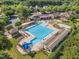 The community pool is a cool oasis surrounded by lush landscaping and multiple seating areas at 1326 Fairview Club Dr, Wake Forest, NC 27587