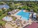 Expansive community pool with lots of lounge seating, a slide and nearby lake and golf course at 1326 Fairview Club Dr, Wake Forest, NC 27587