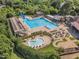 Beautiful aerial view of a community pool featuring ample seating and a separate area at 1326 Fairview Club Dr, Wake Forest, NC 27587