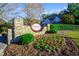 Charming community entrance sign amidst lush greenery and landscaping at 1326 Fairview Club Dr, Wake Forest, NC 27587
