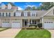 Charming townhome with attached garage, manicured lawn, and covered porch at 1326 Fairview Club Dr, Wake Forest, NC 27587