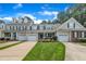An inviting townhome features an attached garage, a front lawn, and a driveway at 1326 Fairview Club Dr, Wake Forest, NC 27587