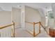 Hallway upstairs featuring wood railings and carpet at 1326 Fairview Club Dr, Wake Forest, NC 27587