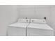 Bright laundry room with standard white washer and dryer units at 1326 Fairview Club Dr, Wake Forest, NC 27587