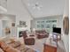 Living room with fire place and backyard view, leather furniture, and carpeted floors at 1326 Fairview Club Dr, Wake Forest, NC 27587