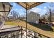Enjoy backyard views from the covered balcony overlooking patio, fire pit, and outdoor living areas at 1603 N Alston Ave, Durham, NC 27701