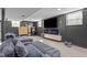 Finished basement with comfortable sectional seating, fireplace, and flat screen television at 1603 N Alston Ave, Durham, NC 27701