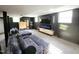 Relax in this finished basement featuring a custom entertainment center and comfortable seating at 1603 N Alston Ave, Durham, NC 27701