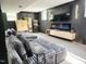 Finished basement featuring an entertainment center, fireplace, and plush seating area at 1603 N Alston Ave, Durham, NC 27701