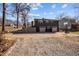 This two story home features a brick facade, two car garage, a basketball hoop and a back entry staircase at 1603 N Alston Ave, Durham, NC 27701