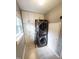 Convenient laundry room featuring a stacked washer and dryer and built-in cabinets for storage at 1603 N Alston Ave, Durham, NC 27701