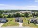 Expansive aerial view of a suburban home featuring a well-manicured lawn and traditional architecture at 172 Fox Run Ct, Benson, NC 27504