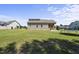 Beautiful back exterior of the home with a spacious yard and a covered porch at 172 Fox Run Ct, Benson, NC 27504