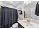 Bathroom with a shower, modern vanity, framed mirror, and stylish decor at 172 Fox Run Ct, Benson, NC 27504