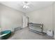 Bedroom with gray crib, toy storage and a window with natural light at 172 Fox Run Ct, Benson, NC 27504