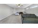 Comfortable bedroom showcasing two twin beds, a plush couch, and natural lighting at 172 Fox Run Ct, Benson, NC 27504