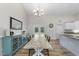 Open dining area with a long wooden table, ample seating, and natural light from sliding glass doors at 172 Fox Run Ct, Benson, NC 27504