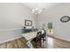 Bright dining area featuring a wooden table with seating and a decorative blue sideboard at 172 Fox Run Ct, Benson, NC 27504