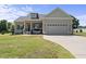Charming single-Gathering home with a two-car garage and covered front porch at 172 Fox Run Ct, Benson, NC 27504