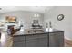 Open concept kitchen island with granite countertops and a view of the dining and living areas at 172 Fox Run Ct, Benson, NC 27504