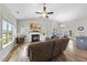 Bright living room with vaulted ceiling, hardwood floors, fireplace, and ample natural light at 172 Fox Run Ct, Benson, NC 27504