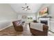 Cozy living room with wood floors, a fireplace, comfortable seating, and a bright, airy feel at 172 Fox Run Ct, Benson, NC 27504