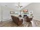 Inviting living room featuring a fireplace, wood floors, neutral paint, and plenty of natural light at 172 Fox Run Ct, Benson, NC 27504