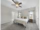 Spacious main bedroom with en suite bath and neutral, plush carpeting at 172 Fox Run Ct, Benson, NC 27504