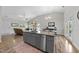 Open concept home featuring living, kitchen, and dining area with neutral walls and vaulted ceilings at 172 Fox Run Ct, Benson, NC 27504