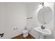 Powder room featuring toilet and modern sink with a dark faucet at 1805 Abby Knoll Dr, Apex, NC 27502