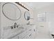 Updated bathroom featuring a double vanity with granite countertop and modern fixtures at 1805 Abby Knoll Dr, Apex, NC 27502